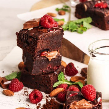 Chocolate glazed raspberry brownie bites with fudgy texture and glossy topping by oooflavors